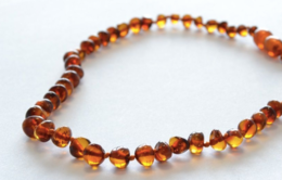  Amber bracelet made of dark cognac-colored beads, suitable for kids.