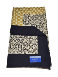 A large, rectangular throw blanket in a black, white, and gold color scheme. The blanket features a patterned design with geometric shapes and floral motifs. The materials used appear to be cotton.