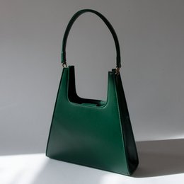 Emerald green leather handbag with a structured, rectangular shape and a single top handle.