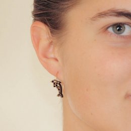 Elegant hoop earrings with a delicate bee design in silver and rose gold tones.
