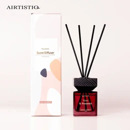Luxury soy wax fragrance diffuser sticks, 100 ml, reed diffuser, square glass bottle with black reed sticks, red liquid fragrance, modern and minimalist design.