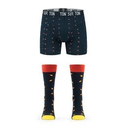 A set of men's matching socks and boxershorts featuring a spaceman design in a navy blue color. The boxershorts have a waistband with the text "TEAM SPACEMAN" printed on it. The socks are a bright red color with the spaceman design.