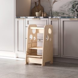  A 3-in-1 growing learning tower made of natural wood with a delicate blue, pink, or coating-free finish. Designed for kids, it features a step stool, platform, and storage space.