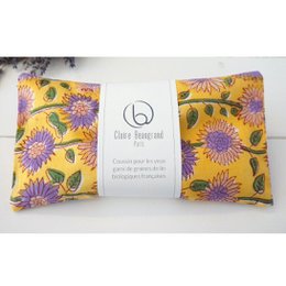  "Vibrant yellow eye cushion with purple and green sunflower pattern. Soft, plush material for soothing eye comfort."
