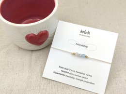 Silver and gold friendship bracelet with heart charm