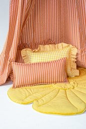 Pink and orange striped bolster pillow with ruffled edges, yellow gingham pattern, soft fabric kids decor