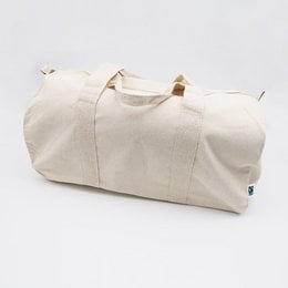 A large, beige canvas weekend tote bag with leather handles and accents.