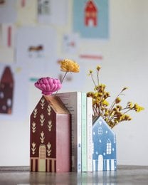 Hand-painted wooden bookends, house-shaped design, burgundy and blue colors, decorative leaf patterns, architectural style.