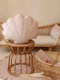 Soft, plush velvet cushion in a latte color with a shell-shaped design, perfect for adding a cozy, textural accent to any room.