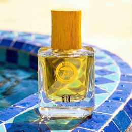 Mazhar Atlas Eau de Parfum is a perfume with a vibrant yellow color and a distinctive glass bottle design. The fragrance features a blend of citrus and floral notes, creating a fresh and sophisticated scent.