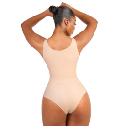  Seamless bodysuit shapewear in nude color, available in sizes S-3XL. Designed to provide a smooth, flattering silhouette.
