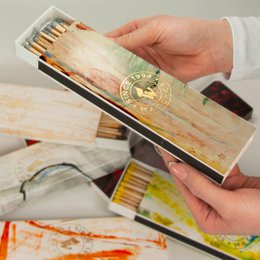 Vintage-style matchboxes with abstract designs in warm tones. Includes details like shapes, textures, and subtle patterns.