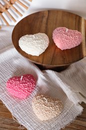  Heart-shaped pillar candles in various colors including natural, pink, and beige.