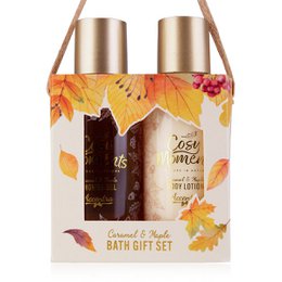  A gift set containing a caramel & vanilla scented body lotion and a matching body wash, packaged in a decorative gift bag with autumn-themed graphics.