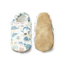  Soft, comfortable baby shoes with a whimsical whale print design and a cozy suede-like interior.