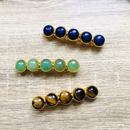 Natural stone barrette with lapis lazuli, aventurine, and tiger's eye beads in gold settings. Elegant and versatile hair accessory.