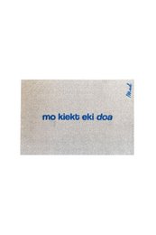 "Beige natural fiber door mat with blue text 'mo kiakti eki doa' minimalist design"