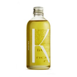 Cleansing oil in a glass bottle with a yellow liquid and a white box.