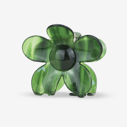 Green floral hair clip with a stylized flower design.