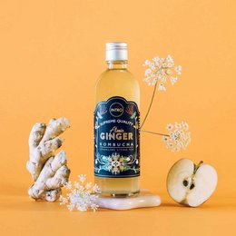 Atomic Ginger Kombucha 0.33L - Ginger-flavored kombucha drink with a vibrant yellow color and floral design on the bottle.