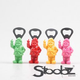  Colorful bottle opener figurines in various shapes and colors, including green, red, yellow, and pink.