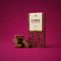  "Milk chocolate hazelnut kunafa, brown square pieces, pink patterned box, luxury gift chocolate"