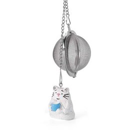 Silver-tone tea infuser with a white cat charm. Stainless steel tea ball with a mesh filter for loose leaf tea. Compact and portable design for easy brewing.