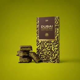  Dark chocolate pistachio kunafa bar, brown packaging with geometric gold pattern, segmented squares, luxury gift box.