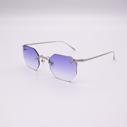 Sleek, modern rimless sunglasses in a vibrant purple gradient lens. Crafted with a lightweight metal frame for a comfortable, stylish fit.