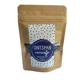  Herbal tea with chamomile, relaxing and soothing blend, packaged in a kraft paper bag with a polka dot design.