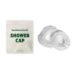 A disposable shower cap made of cornstarch material, suitable for hotel amenities.
