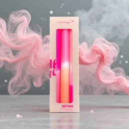 Tall, vibrant dip-dyed neon candles in shades of pink and orange. The candles have a unique, modern style and would make a stylish addition to any dinner table or home decor.