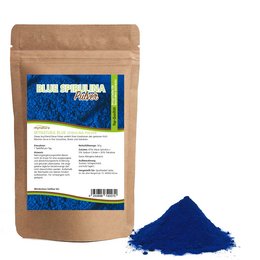 Blue spirulina powder in a paper bag. The powder has a vibrant blue color.