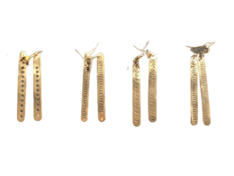 Unique handmade brass statement earrings with a modern, minimalist design featuring a long, linear shape and textured surface.