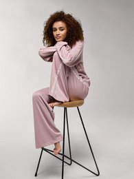  Wide leg pink pants with a relaxed, comfortable fit. Made from a soft, stretchy material for all-day wear. Features an elastic waistband and side pockets.