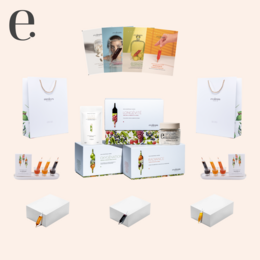 A set of white and colorful boxes and containers, likely containing spa or beauty products. The products appear to be part of a kit or collection for a spa or beauty institute.