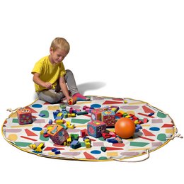 Colorful, round play mat with various toys and a young child playing on it. Includes a variety of shapes, textures, and colors for imaginative play.