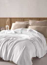 Soft, luxurious beige bedspread with a minimalist, modern design. Made of high-quality materials for a cozy, comfortable sleep experience.