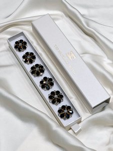 MAJA - Zwart- en witte bloemknop Charme goud