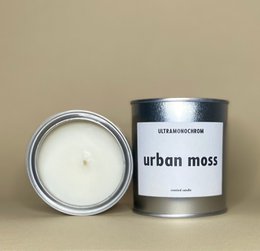 Tall, round, scented candle in an urban moss fragrance, with a clean, minimalist design.