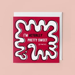 Greeting card with playful, abstract design featuring the text "I'm actually pretty sweet" in a bold, stylized font against a bright red background.