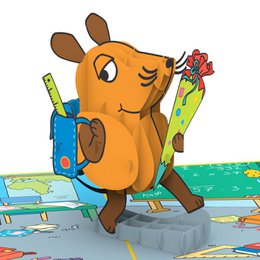 A pop-up card featuring the character Maus, a cartoon mouse, holding school supplies and standing on a colorful map background. The card is described as an "official licensed product".