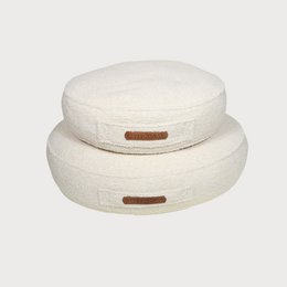  Cream round dog bed, soft fabric, brown leather label, cozy pet mattress, multiple sizes available.