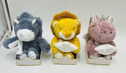 Plush animal toys in various colors and styles, including a blue monster, a yellow duck, and a pink rabbit. The toys appear to be made of soft, fuzzy material.