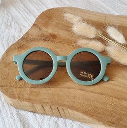 Round, UV400 sunglasses in sage green and peach colors, suitable for babies and children.