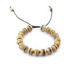 A yellow bracelet made from recycled skateboards, featuring a unique and eco-friendly design.