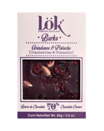 Dark chocolate bark with cranberries and pistachios. 70% cacao content. Rectangular chocolate bar with visible dried cranberries and pistachio nuts.