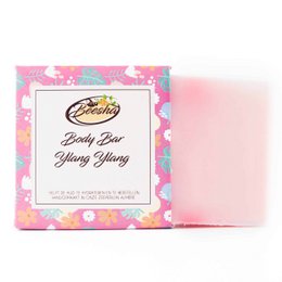 A pink, floral-patterned bar of Ylang Ylang scented body soap.