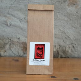 A refill pack of delicious tomato seasoning. The packaging features a red and black label with a crown icon, indicating a premium quality product.