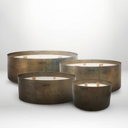 Tall, round, bronze-colored candle holders in various sizes. Suitable for use as dinner candles or home decor.